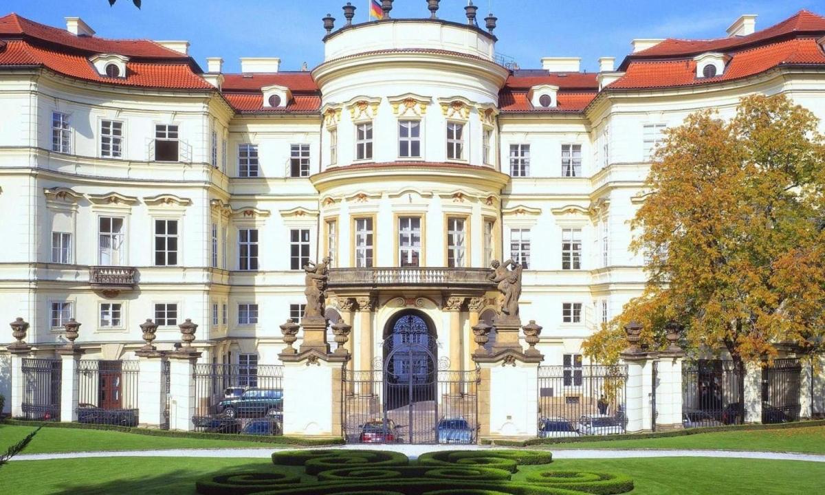 a large white building with a red roof