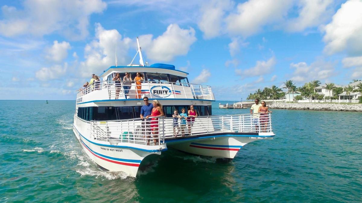 a group of people on a boat in the water