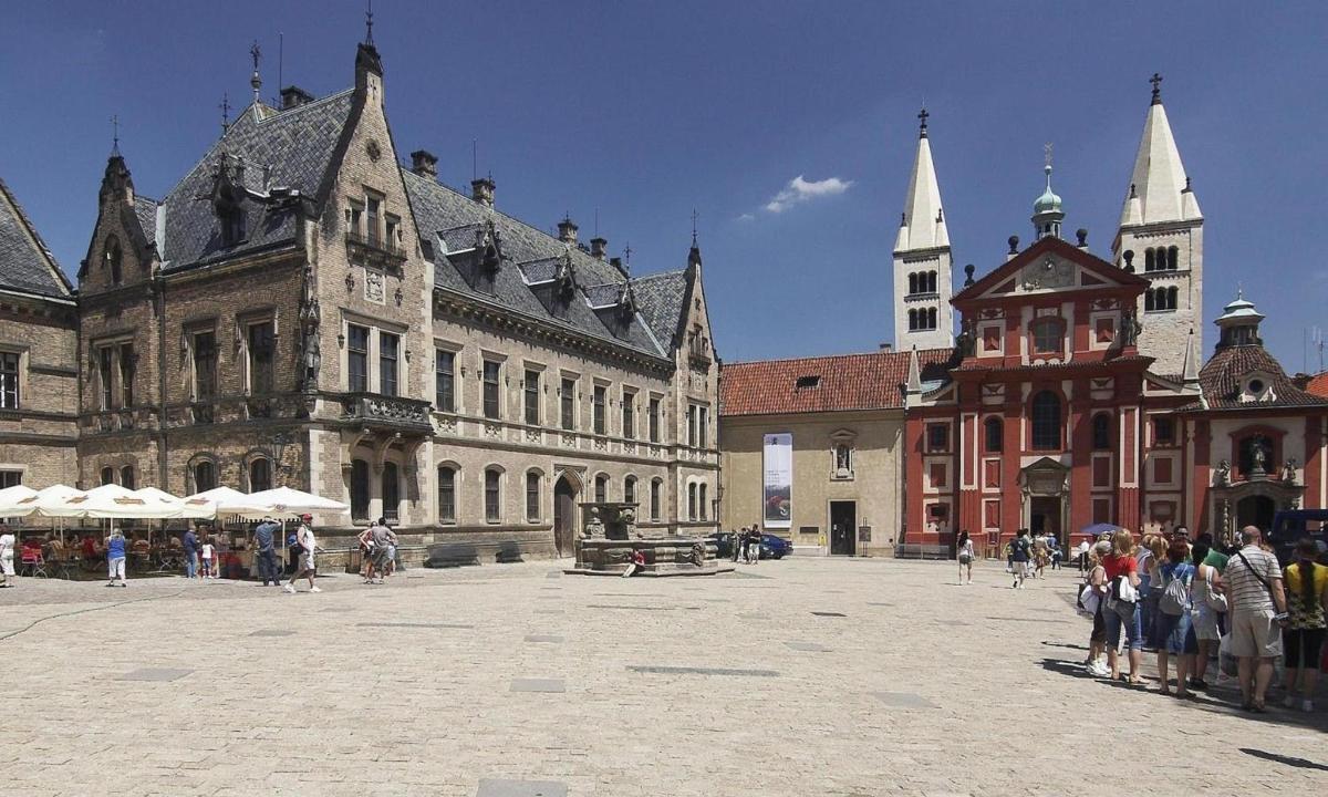a group of people standing in a courtyard in a building