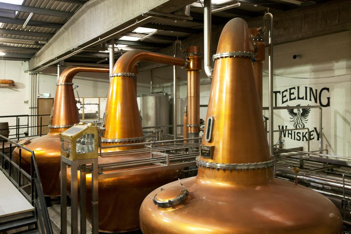 a row of copper vests in a brewery