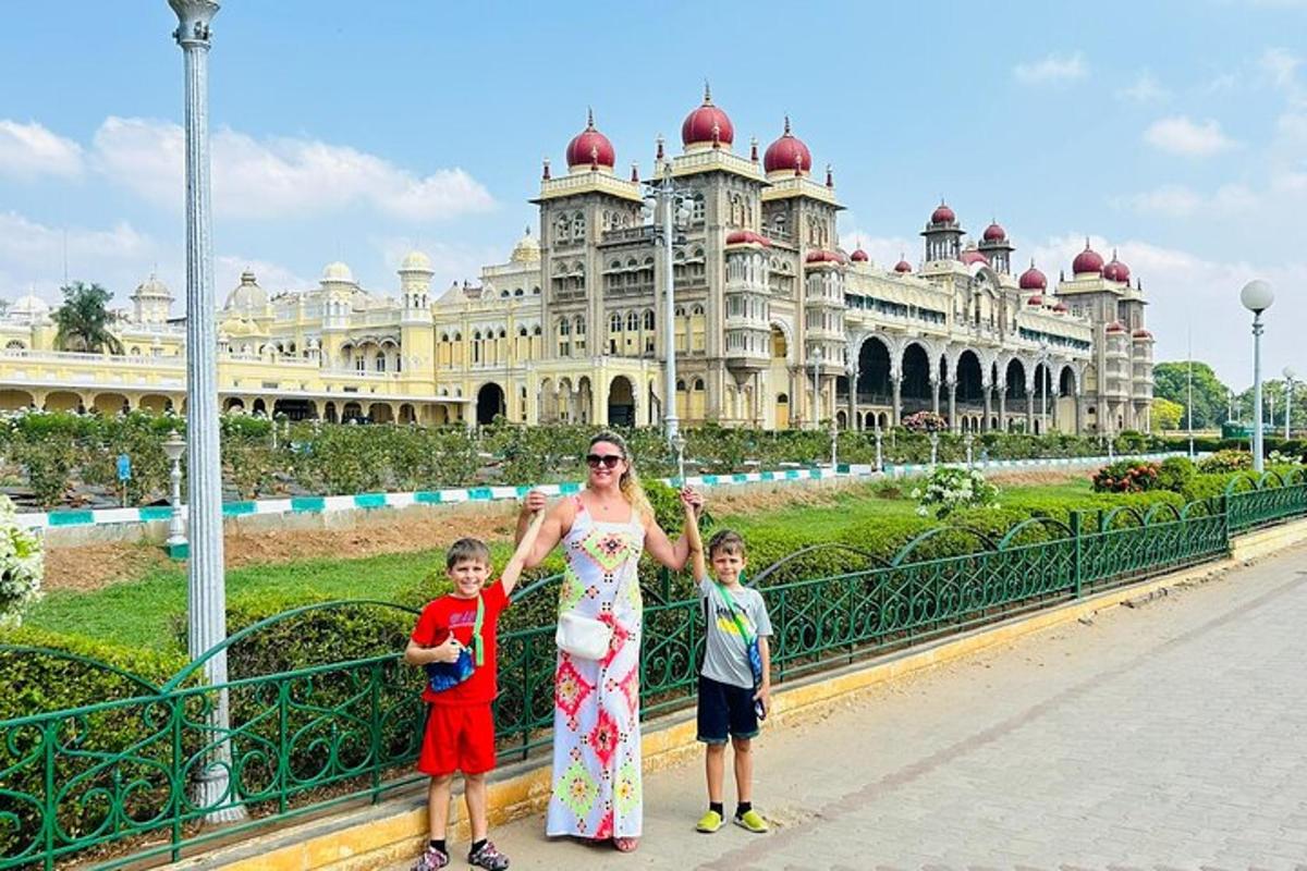 a woman and two children standing in front of a building