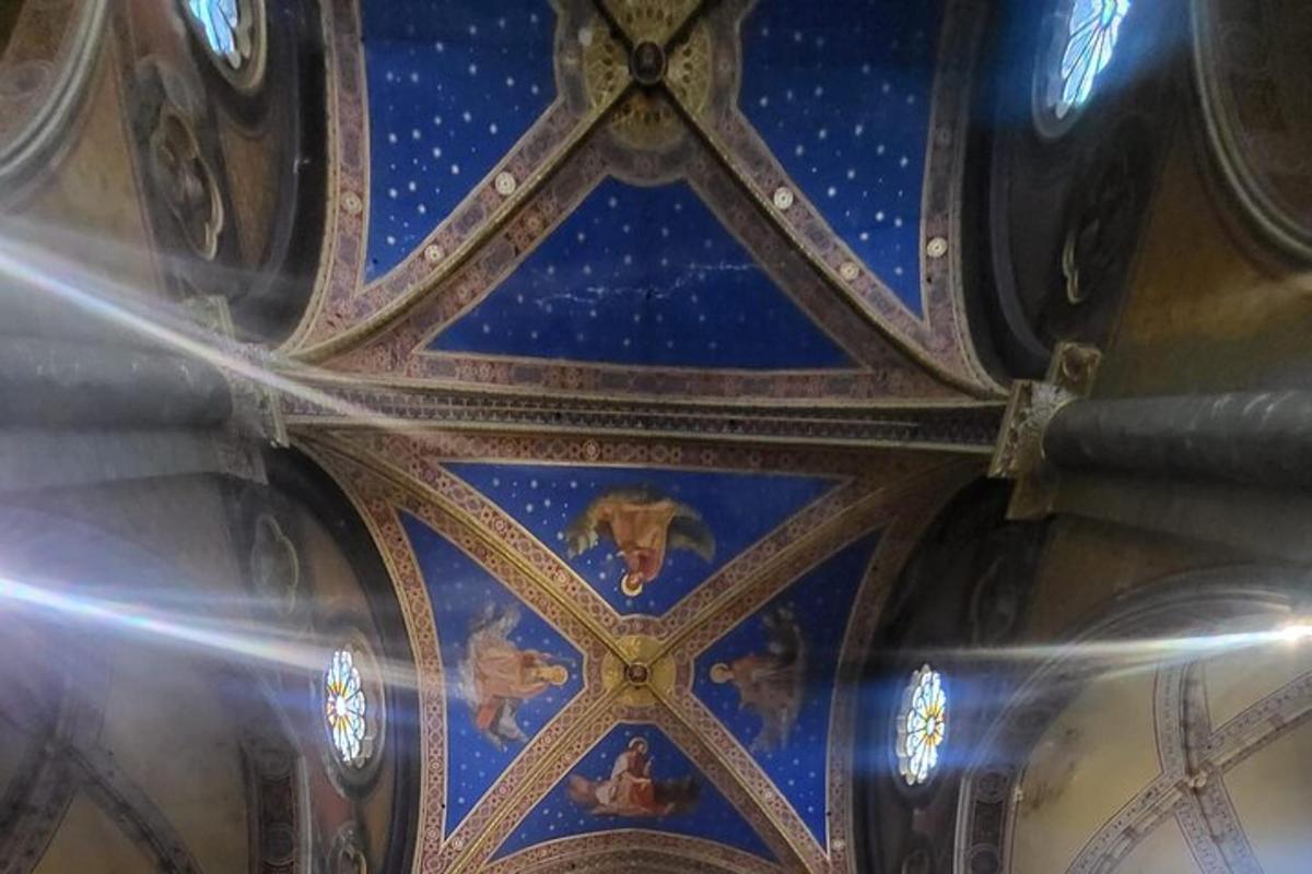 a ceiling of a building with a blue ceiling