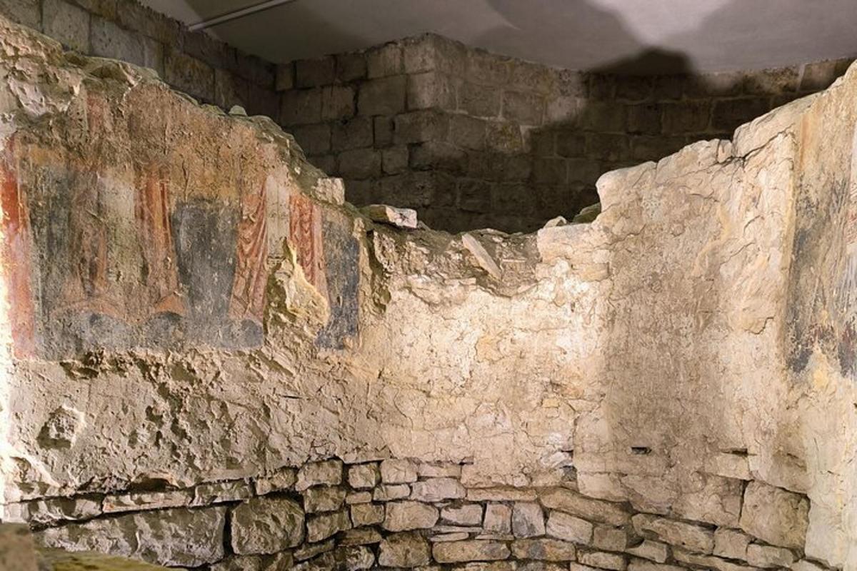 an old stone wall with graffiti on it