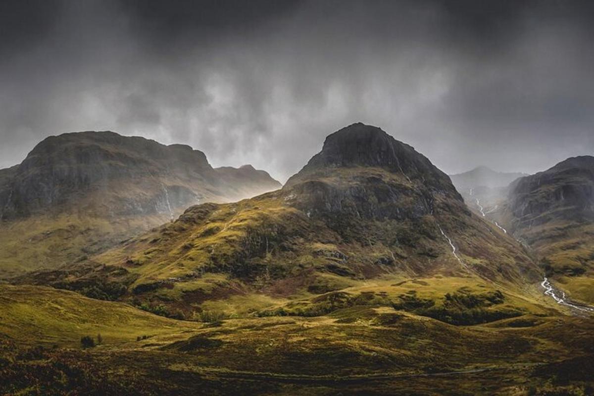 a view of a mountain range with a cloudy sky