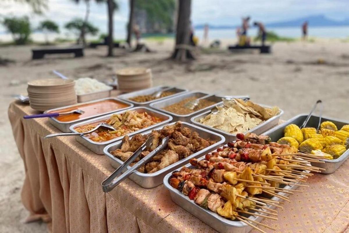 a buffet of food on a table at the beach