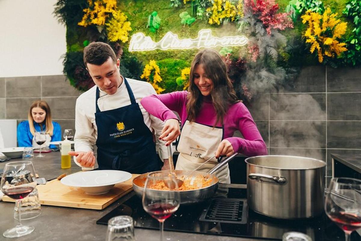 a man and woman preparing food in a kitchen