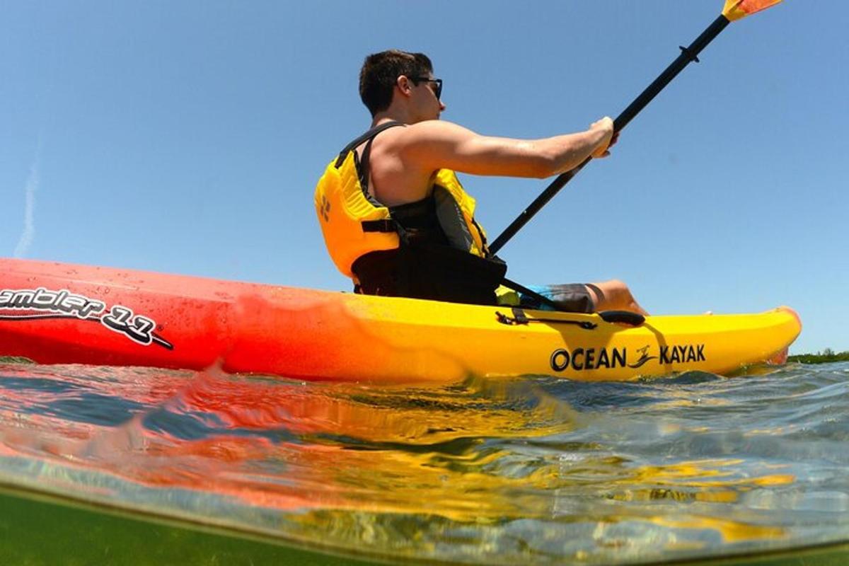 a man in a kayak in the water