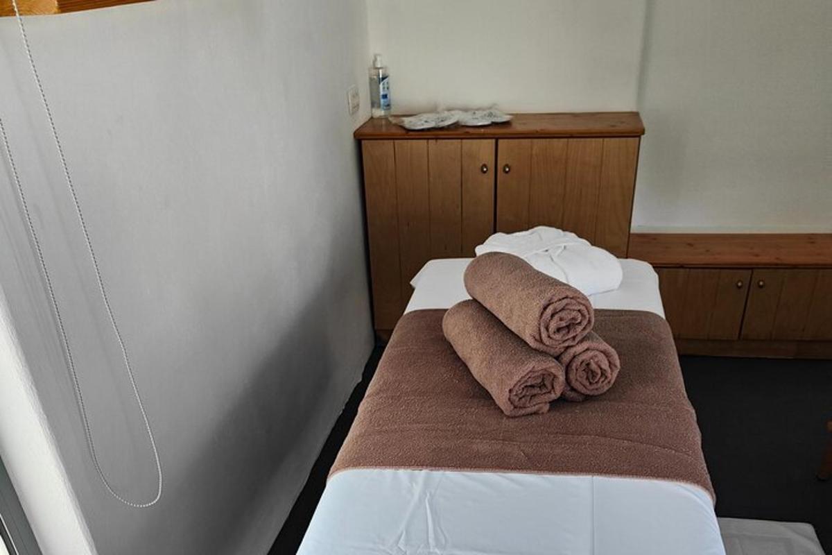 a room with a bed with towels on it