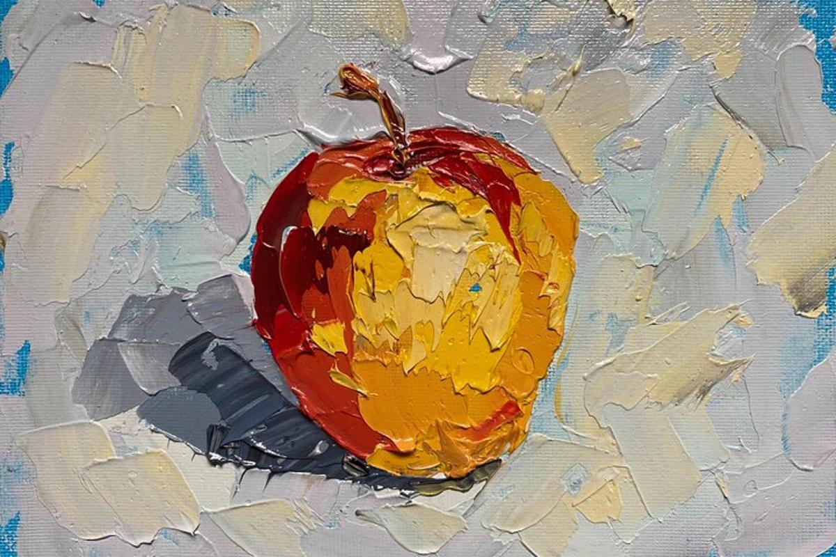 una pintura de una manzana roja sobre un lienzo