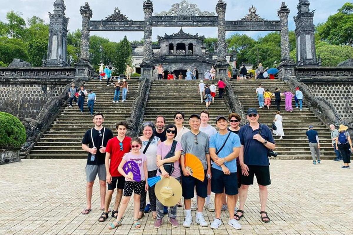 a group of people posing in front of a building