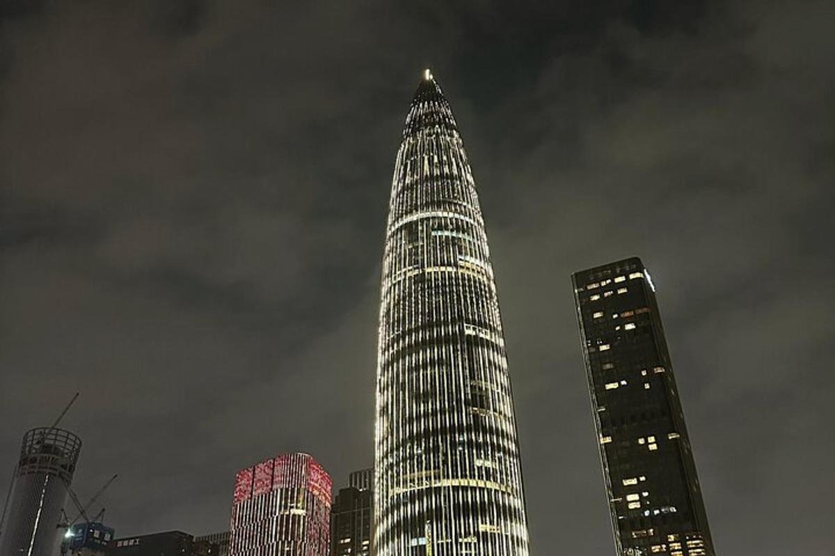 a tall building is lit up at night