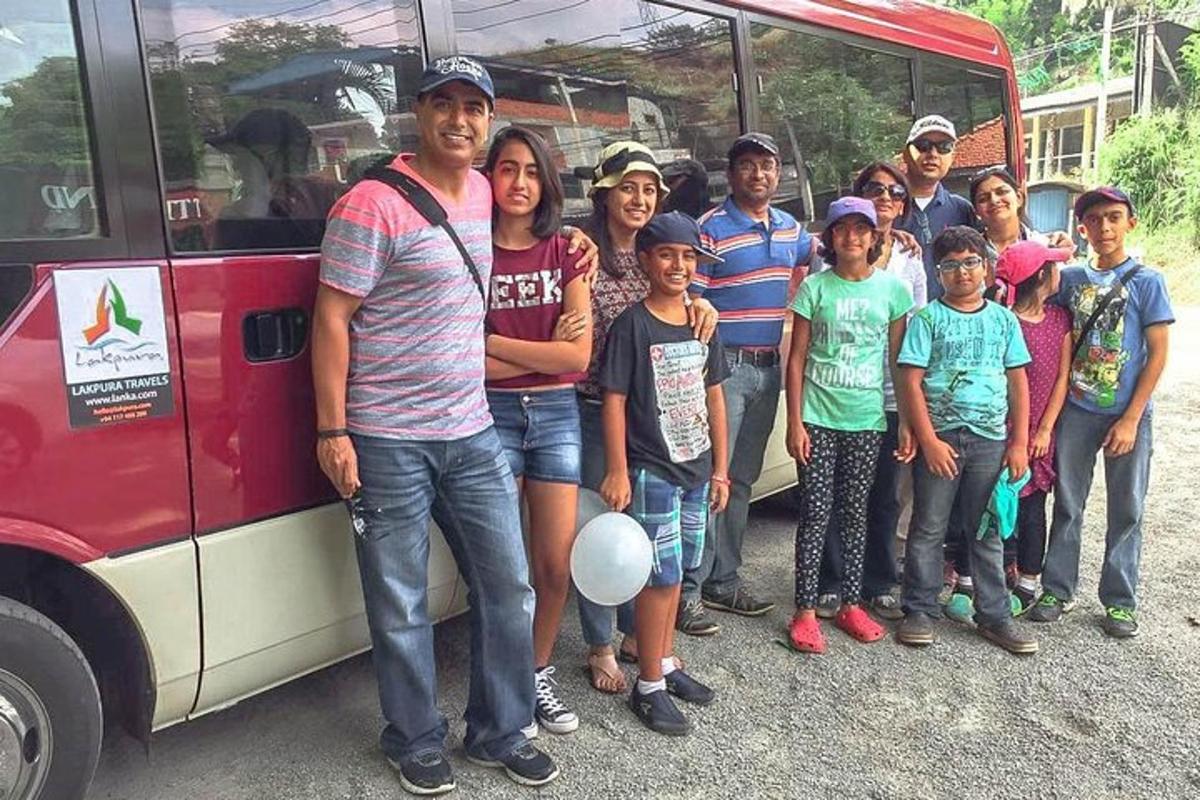 a group of people standing in front of a bus