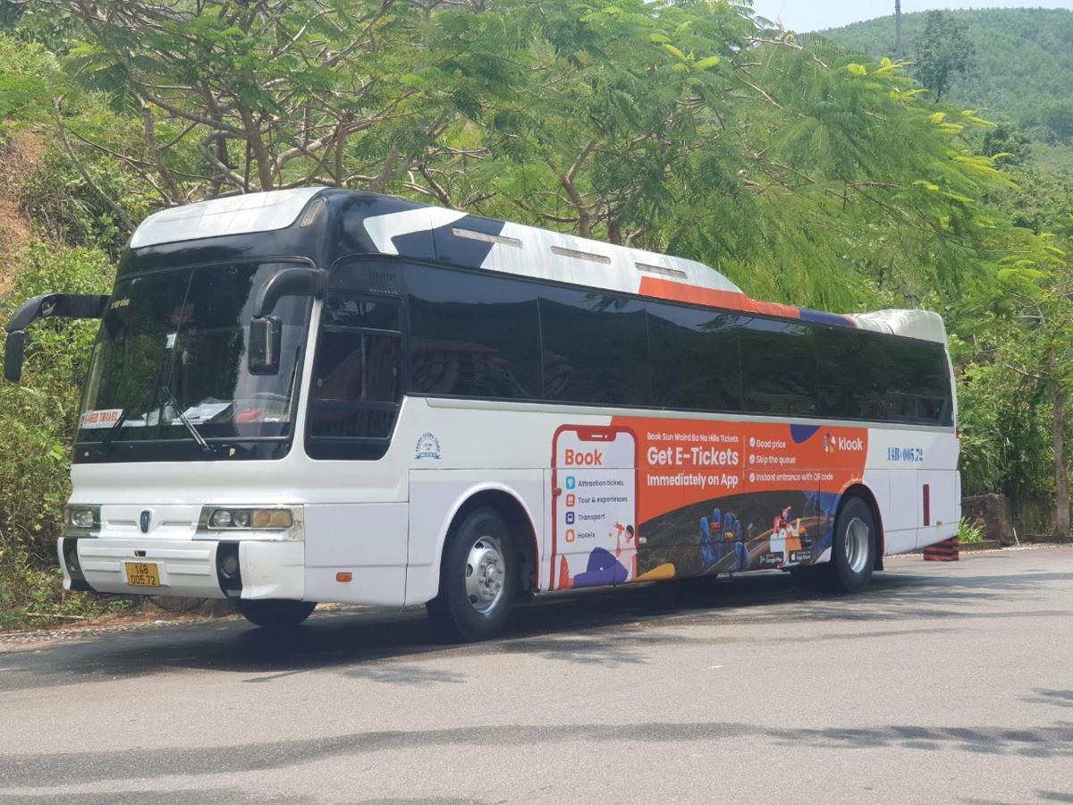 a white bus parked on the side of the road
