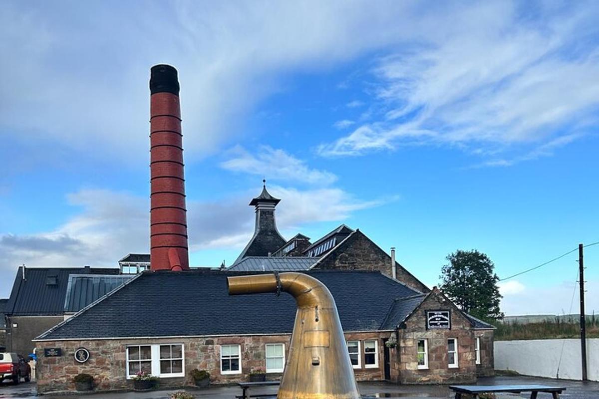 an old brick building with two chimneys on top of it