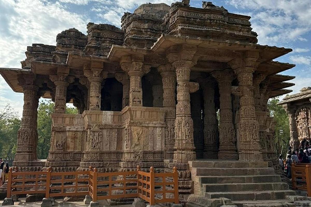 a large stone building with people standing around it