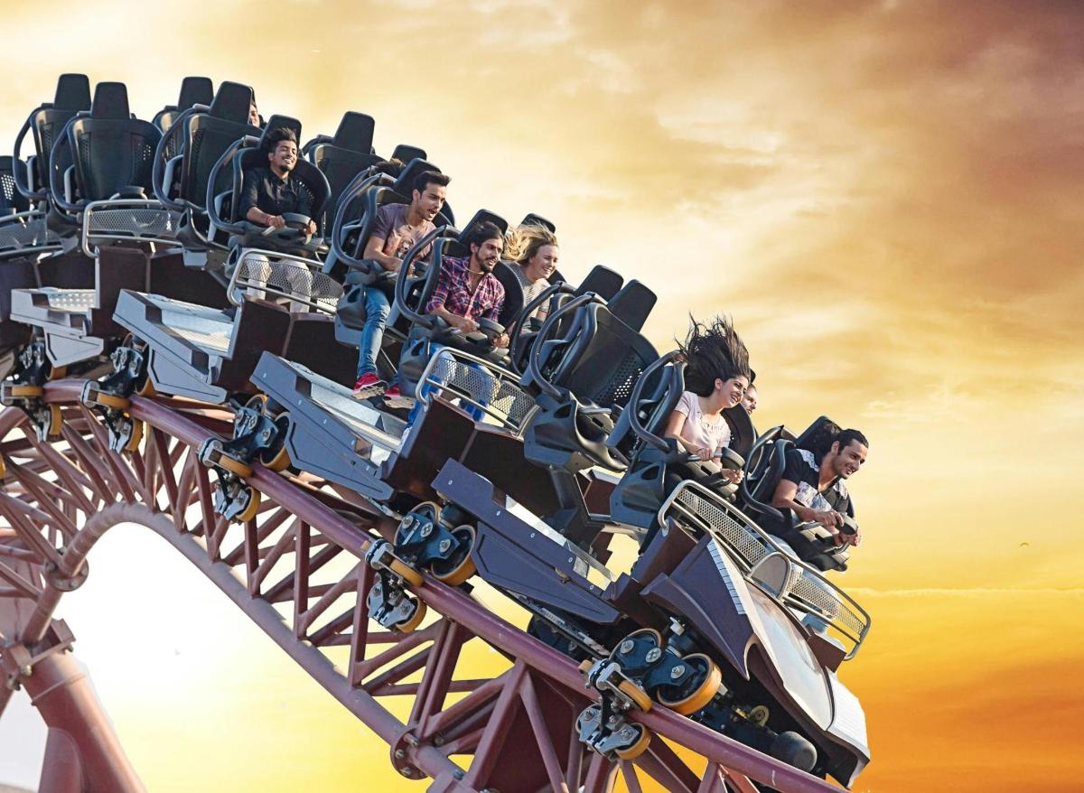 a group of people riding on a roller coaster