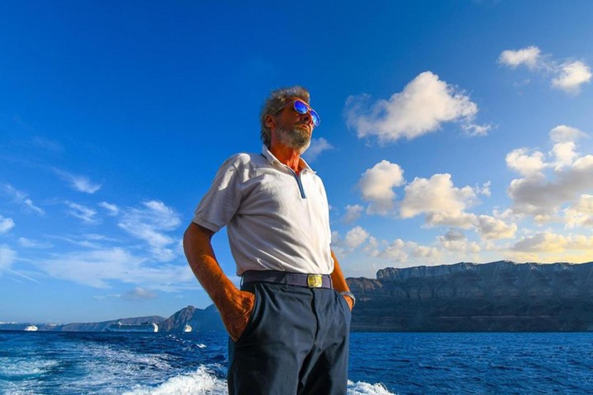 a man standing on a boat in the water