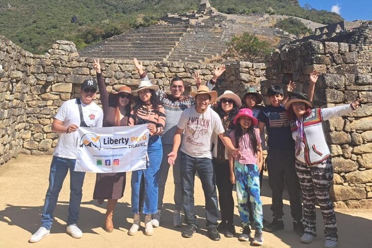 a group of people posing for a picture at a pyramid