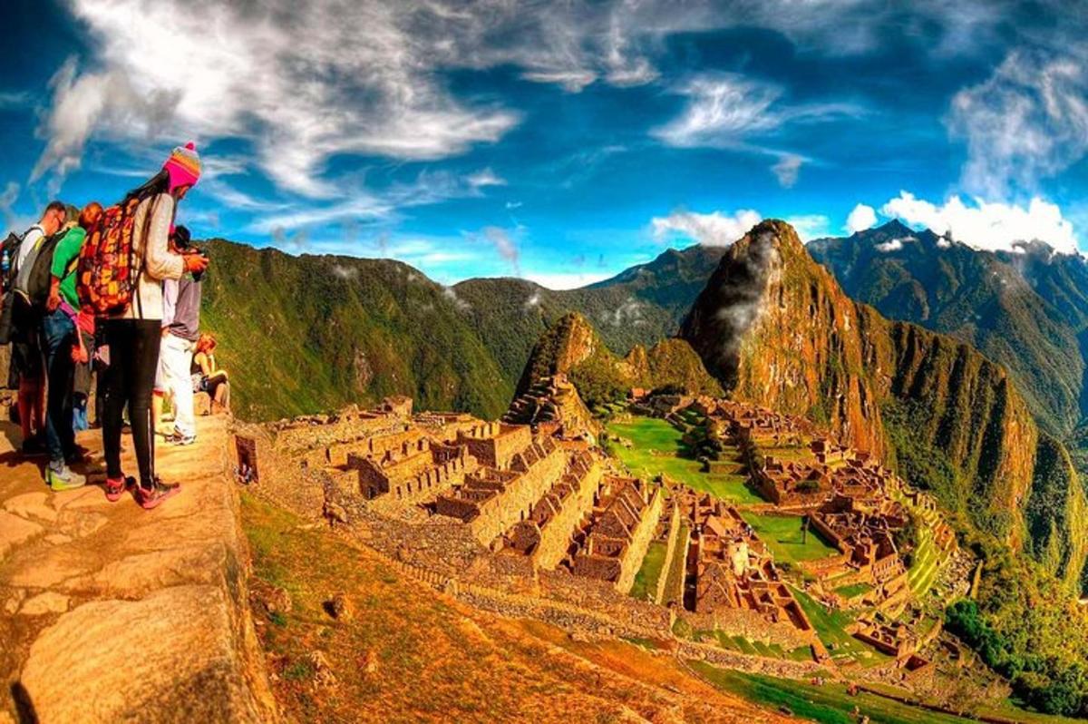 a group of people standing on top of a mountain
