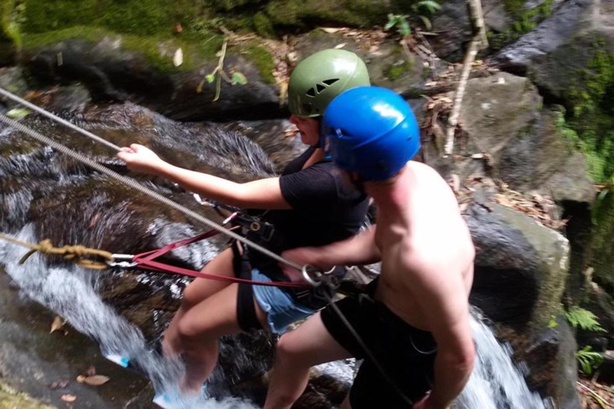 two people are on a raft in a river