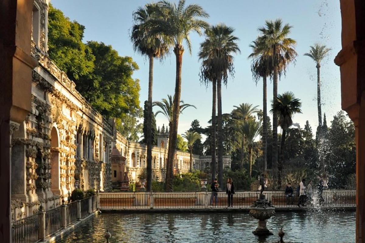 a pool of water with palm trees and a building