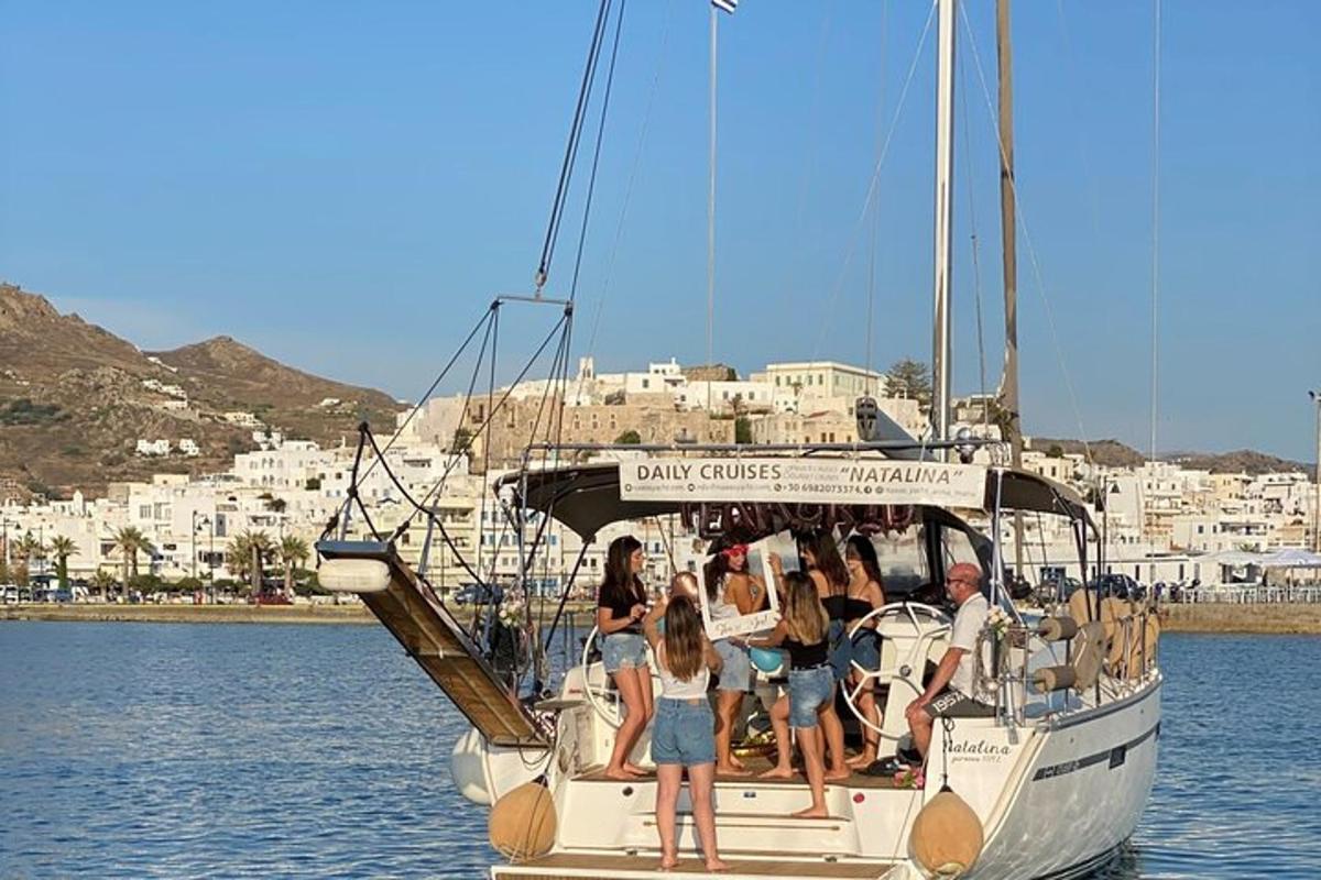 a group of people on a sail boat in the water