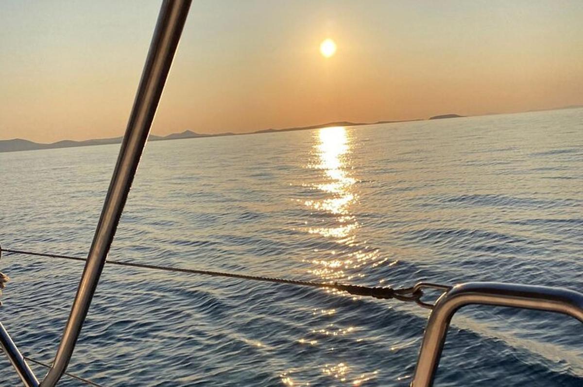 a view of the ocean from a boat at sunset