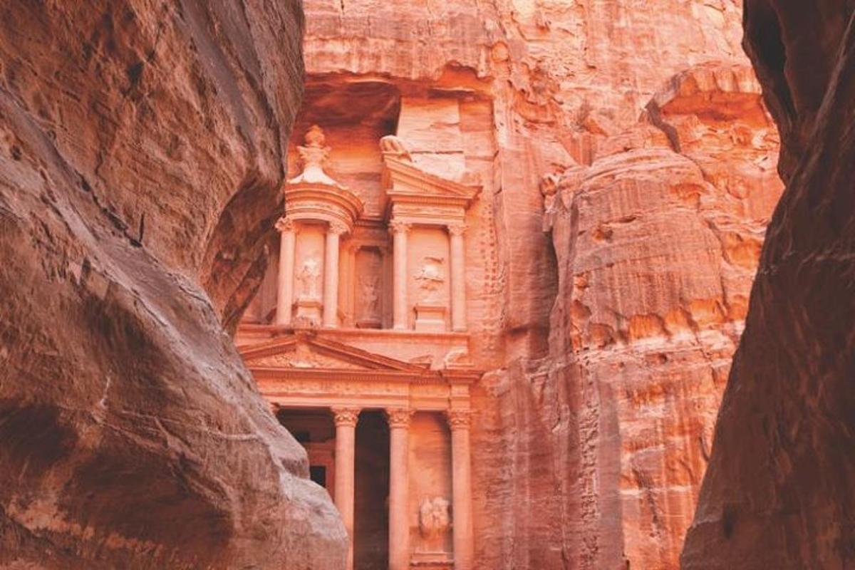 a building carved into the side of a cliff