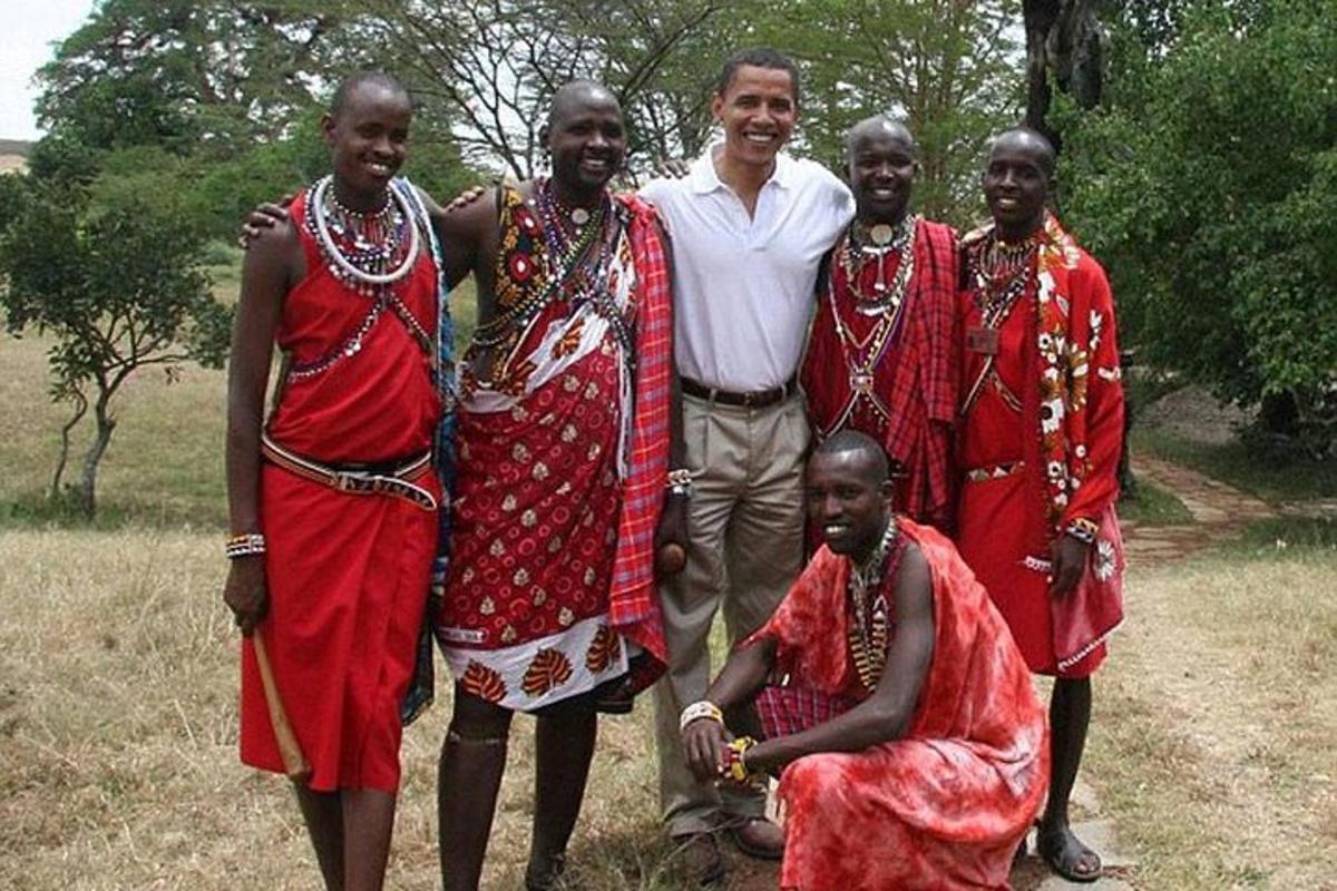 a man standing next to a group of people