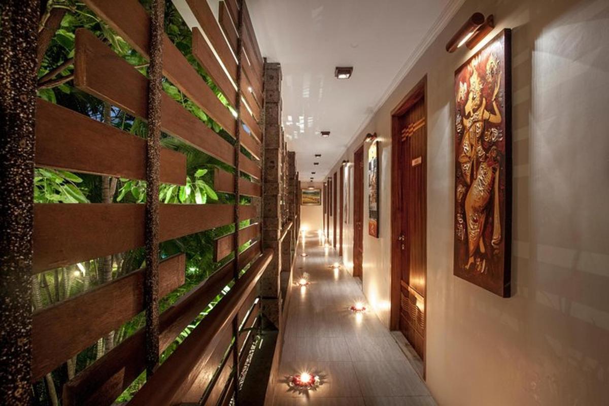 a corridor of a building with plants on the wall