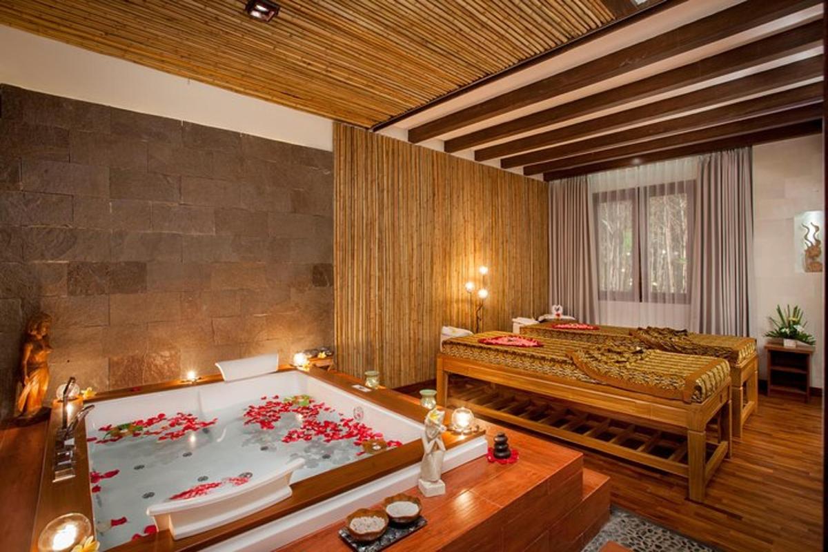 a room with a bath tub and a bed