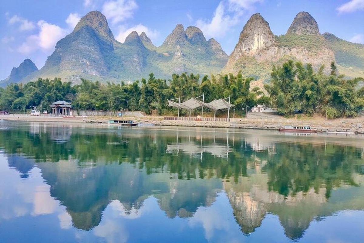 a large body of water with mountains in the background