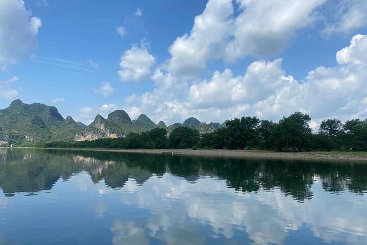 a body of water with mountains in the background