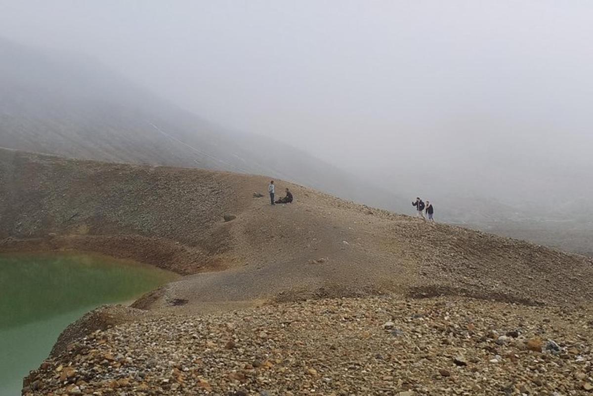 a group of people standing on top of a mountain