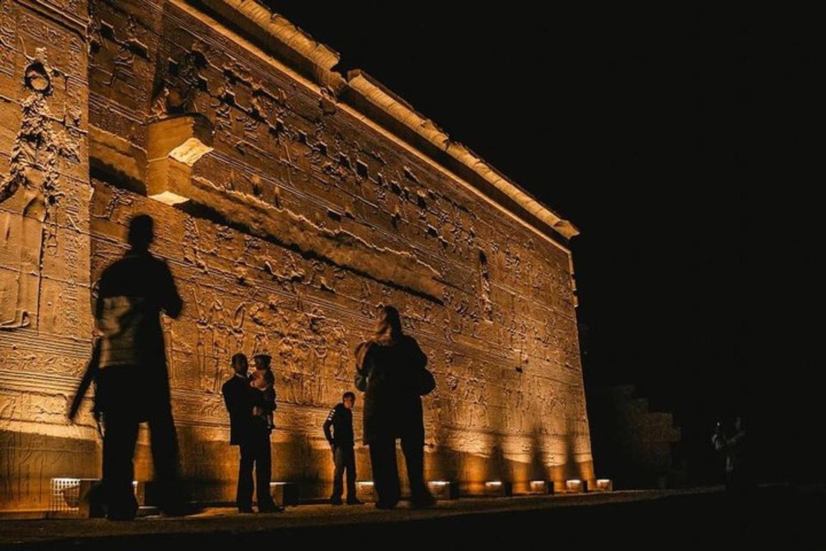 a group of people standing in front of a brick building