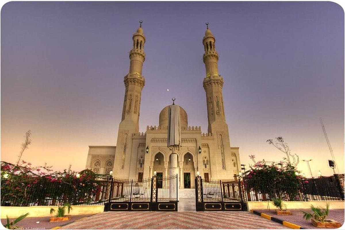 a large mosque with a fence in front of it