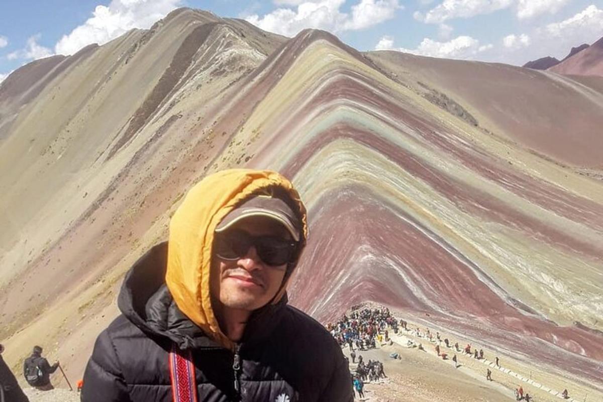 a man standing in front of a mountain