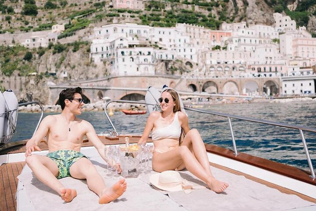 a man and a woman sitting on a boat