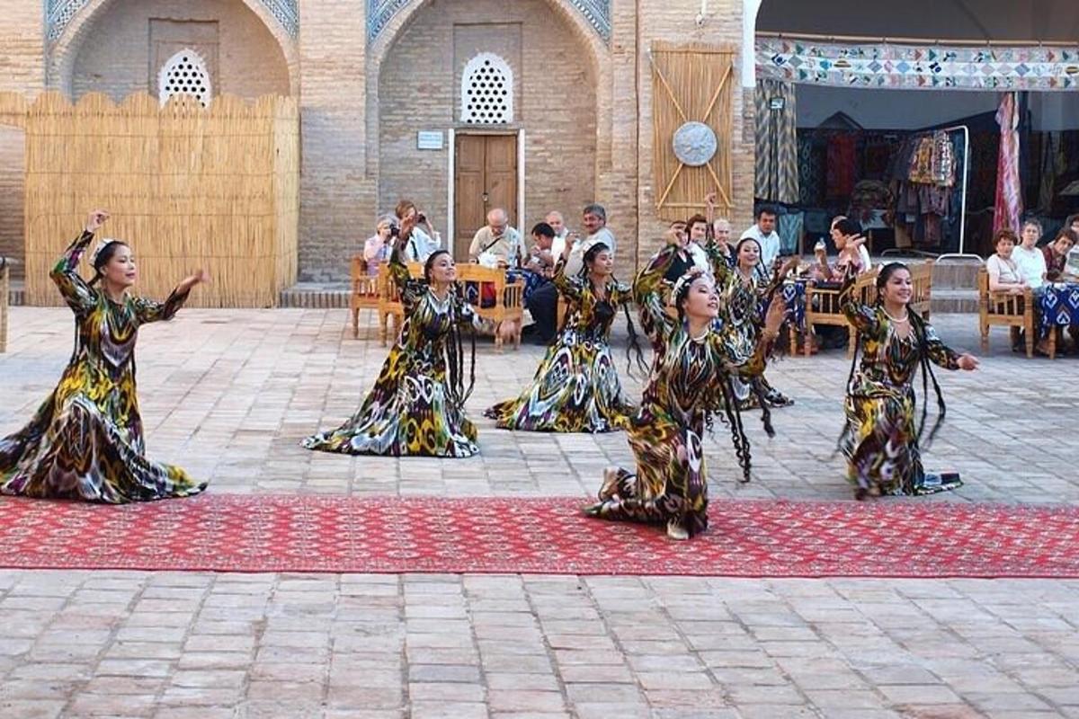 a group of women performing a dance in front of a crowd