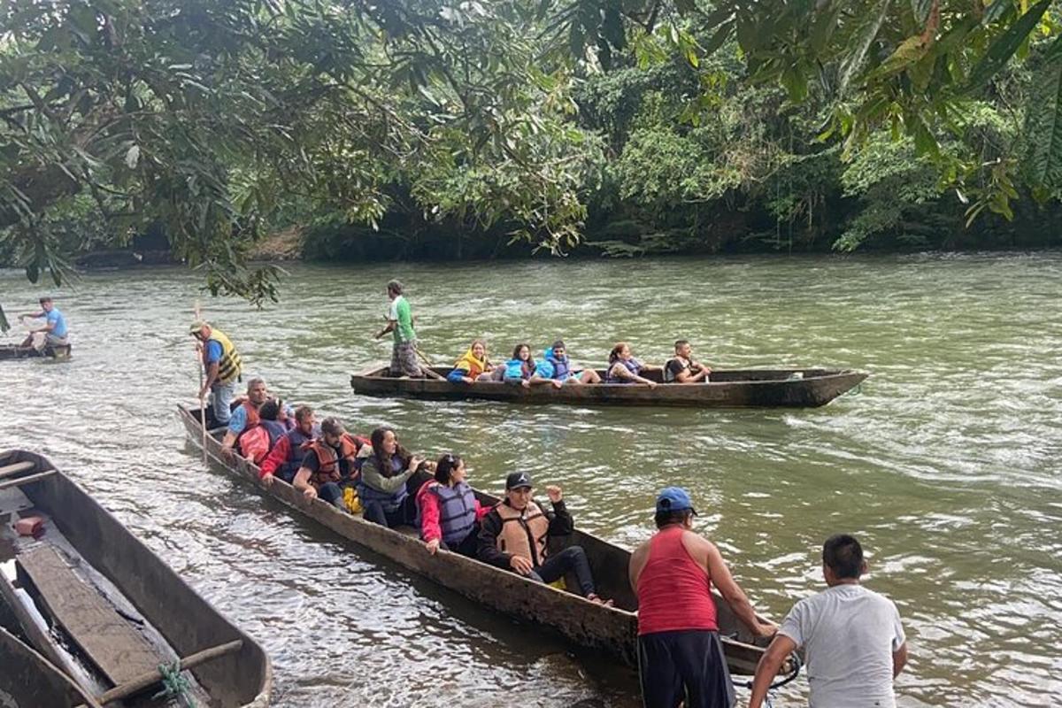 a group of people in a boat on a river