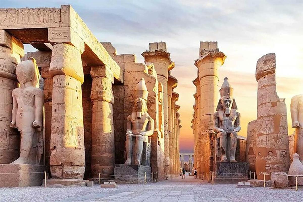 a group of statues standing next to a building