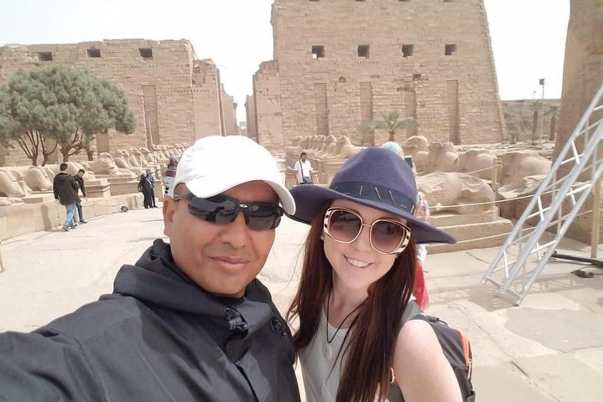 a man and a woman standing in front of a building