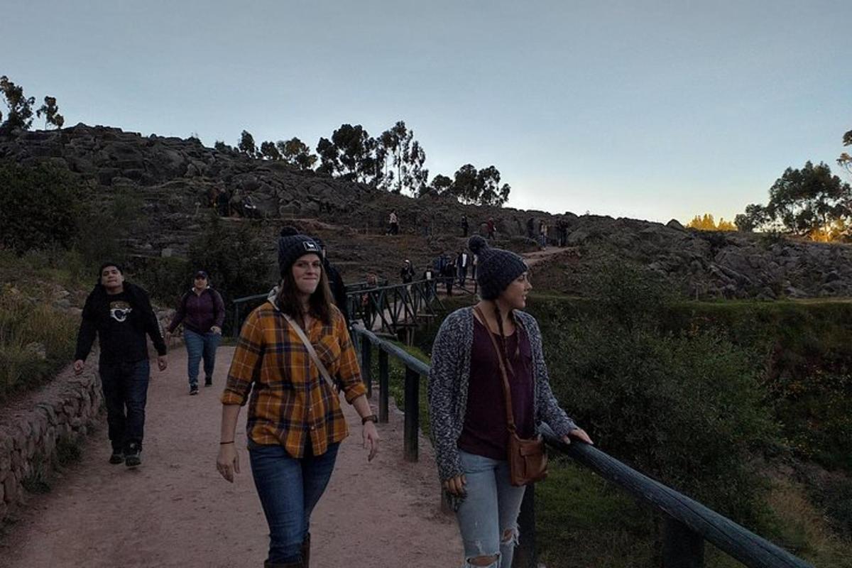 a group of people walking down a trail