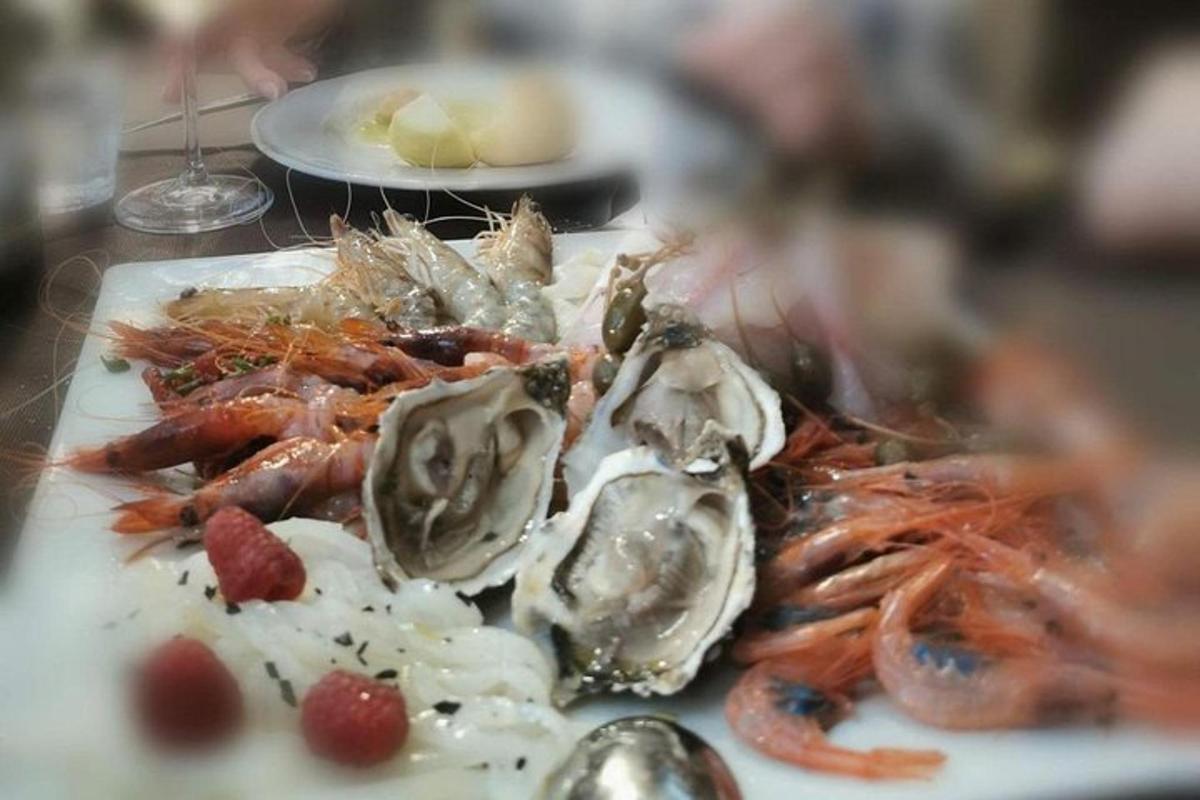 a plate of food with seafood on a table