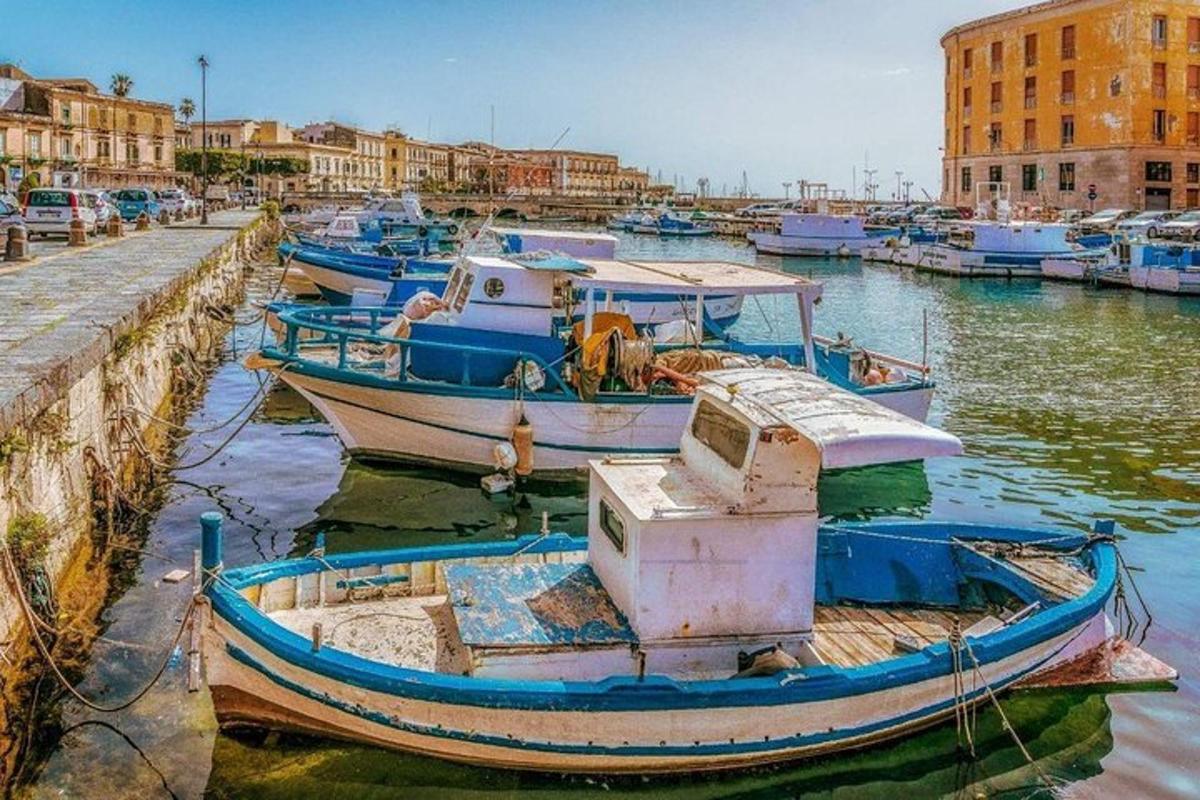 a group of boats are docked in a harbor
