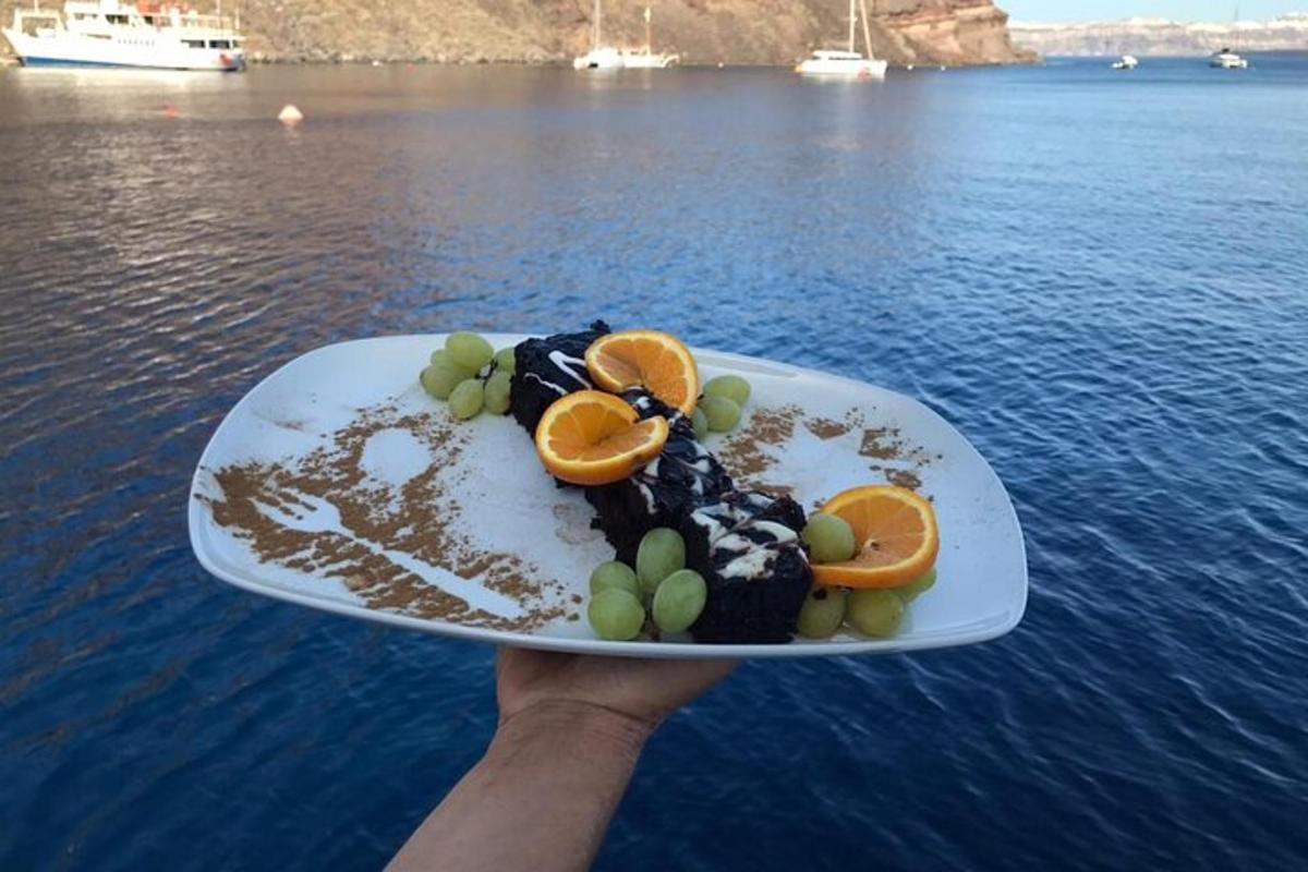 a person holding a plate of food on top of the water