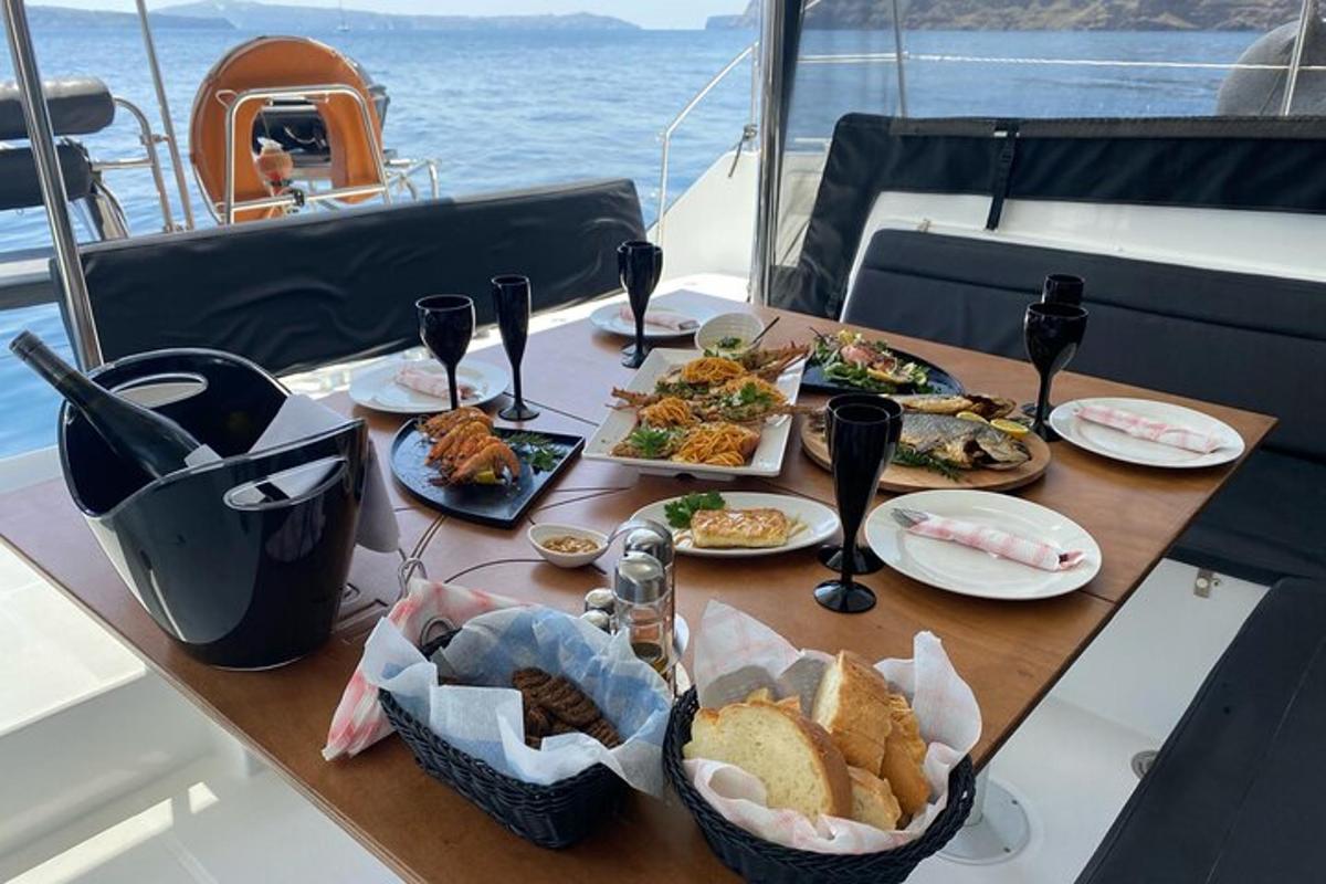 a table with plates of food on a boat