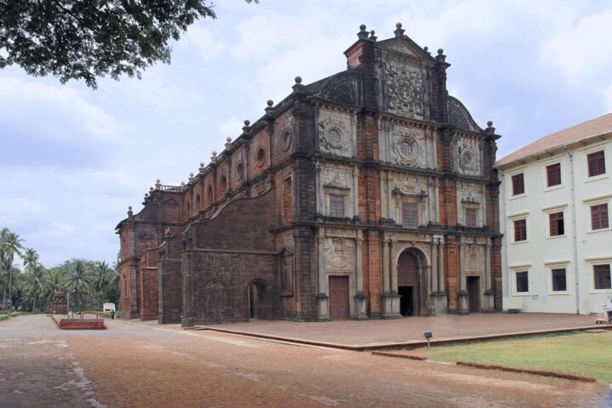 an old brick building with a clock tower on a street