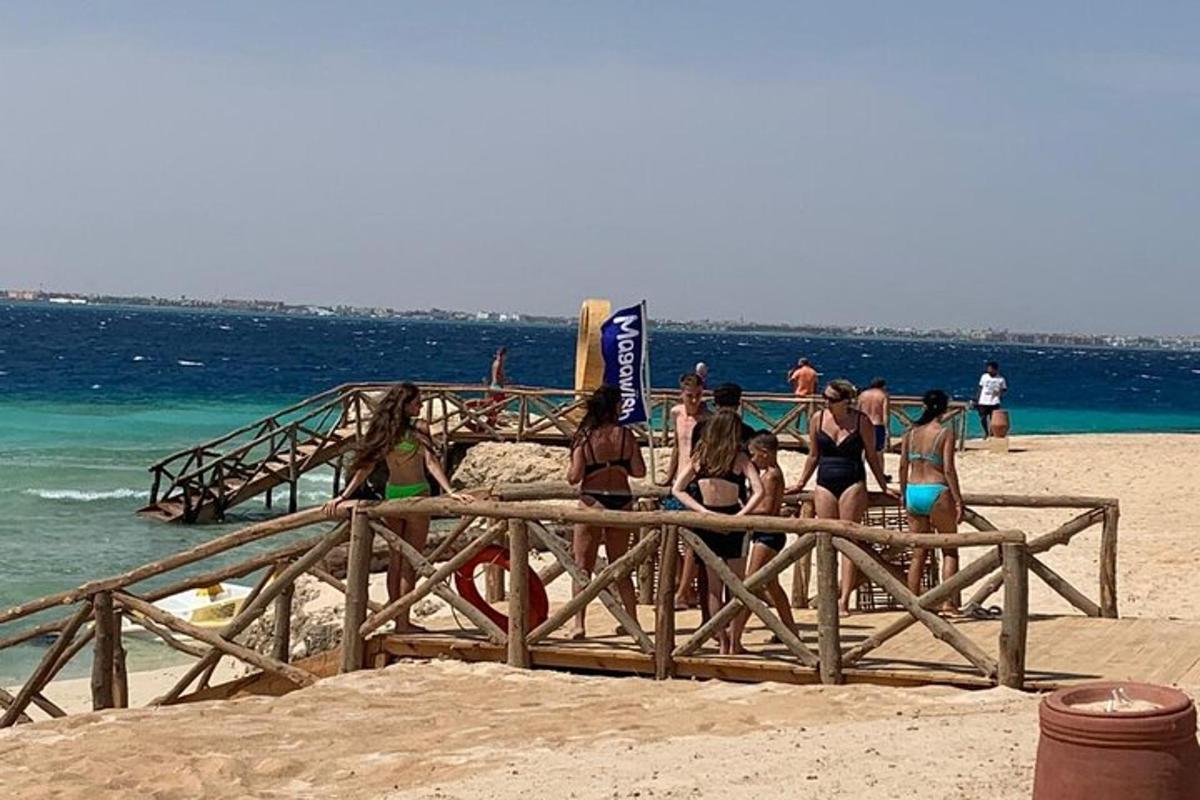 a group of people in bathing suits on a beach