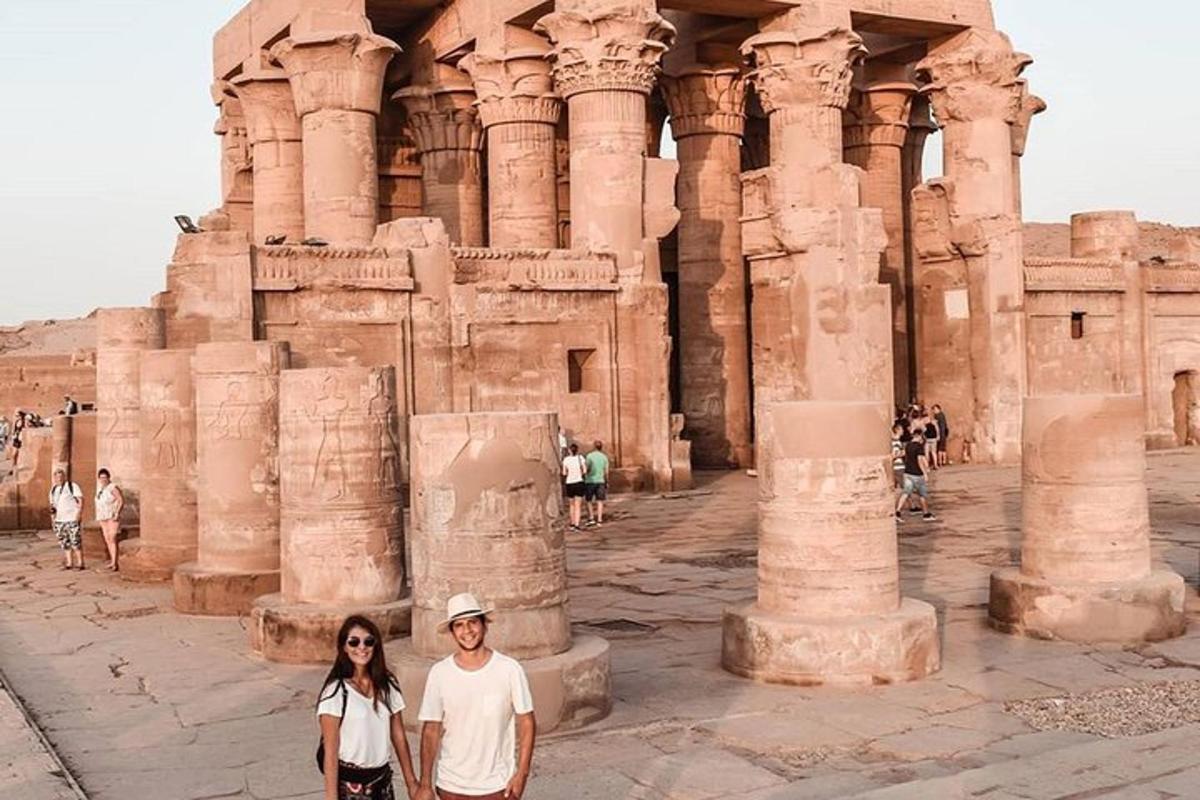 a man and a woman standing in front of a building